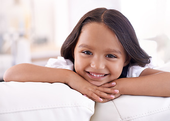 Image showing She knows shes adorable. Cropped portrait of a little girl lying on the sofa at home.