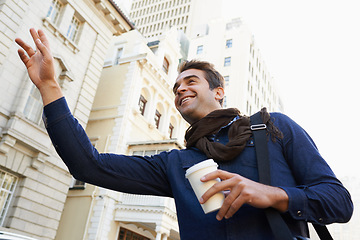 Image showing I havent seen you in years. Low angle shot of a man drinking a coffee and greeting someone in the city.