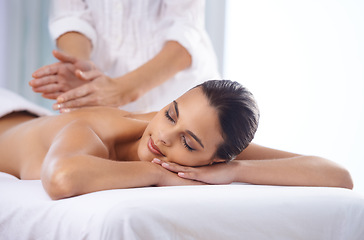 Image showing It doesnt get anymore relaxing...Cropped shot of a beautiful young woman relaxing during spa treatment.