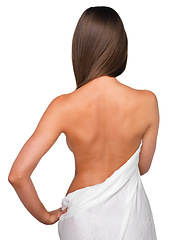 Image showing Behind beauty. Rearview shot of a beautiful young woman wrapped in a blanket.