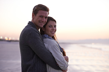 Image showing Theres nothing like young love. A young couple enjoying a romantic moment together at the beach.