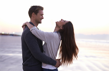 Image showing Theres nothing like young love. A young couple enjoying a romantic moment together at the beach.