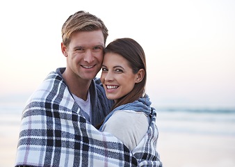 Image showing Theres nothing like young love. A young couple enjoying a romantic moment together at the beach.