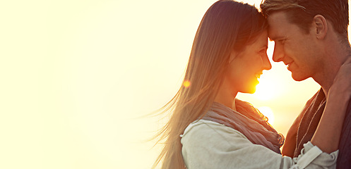 Image showing Theres nothing like young love. Shot of a young couple enjoying a romantic moment at the beach.