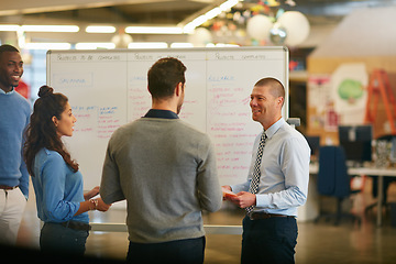 Image showing Success is reason enough to smile. Cropped shot of a group of businesspeople talking in the boardroom.