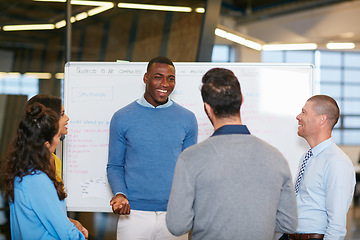 Image showing Sharing his vision. Cropped shot of a group of businesspeople talking in the boardroom.