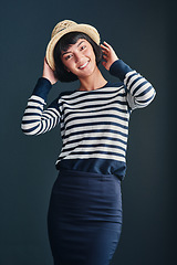 Image showing Be and do whatever makes you happy. Studio shot of an attractive young woman against a dark background.