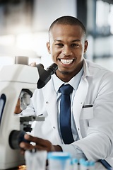 Image showing Im making scientific breakthroughs. Cropped portrait of a handsome young male scientist using a microscope while doing research in his lab.