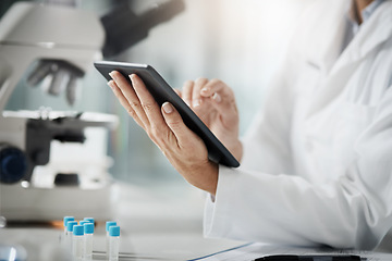 Image showing Making a record of her research. Cropped shot of an unrecognizable mature female scientist using a tablet while doing research in her lab.