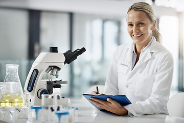 Image showing Im here to cure. Cropped portrait of an attractive mature female scientist taking down notes while doing research in her lab.