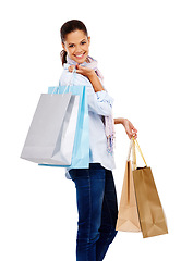 Image showing Woman, bag and shopping in studio portrait with white background, isolated and retail store sales. Happy customer, model and gift bag product, market deal and discount promotion of luxury brand offer