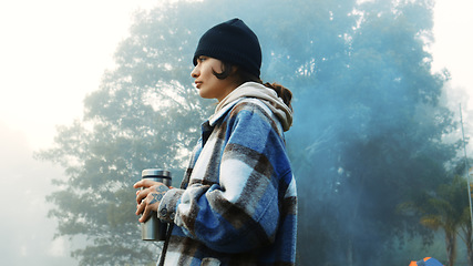 Image showing Thinking, nature and a woman with coffee on vacation, relax and camping in the woods. Calm, idea and a young girl drinking tea in the morning in a forest during a holiday in winter for travel