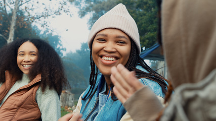 Image showing Camping, laughing and friends in conversation in nature on winter weekend trip or holiday. High five, celebration and women talking and making funny jokes together in a forest on an outdoor vacation.