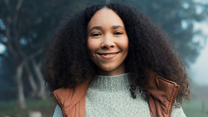 Image showing Portrait, face and a happy woman outdoor in nature to relax and breathe fresh air. Vacation, calm woods and closeup of a young african girl on holiday or hike on misty morning with a confident smile