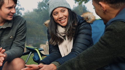 Image showing Wood, fire and warm hands on camping, trip or adventure in nature, forest or friends together at a bonfire in winter. Campfire, smoke and group relax on outdoor vacation, holiday or warming hand