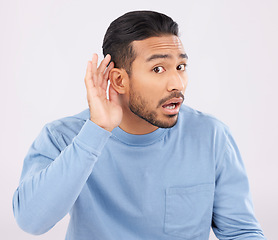 Image showing Ear, hands and portrait of asian man with listen, whisper or hearing secret, gossip or news on white background in studio. Confused, what and guy face with emoji for deaf, speak up or volume gesture