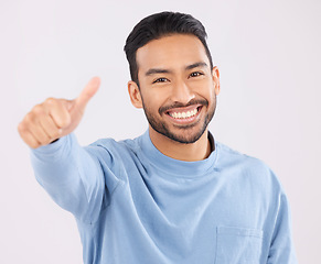 Image showing Portrait, smile and asian man in studio with thumbs up, hand or thank you sign on grey background. Happy, face and Japanese male with finger emoji for yes, vote or positive review, success or agree