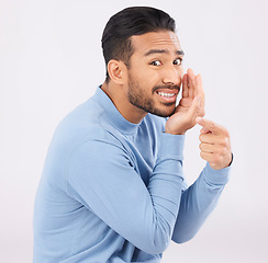 Image showing Hand pointing, whisper and portrait of asian man in studio with secret, drama or rumor on grey background. Face, gossip and Japanese guy with bullying sign, body language or confidential sneaky news