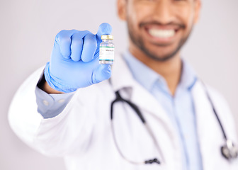 Image showing Vaccine, doctor hands and monkeypox bottle for safety, medicine development and healthcare innovation in studio. Closeup of medical worker with vaccination, liquid vial and drugs for virus immunity