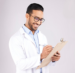 Image showing Happy man, doctor and writing on clipboard in studio, planning documents and healthcare schedule. Asian medical worker with report of insurance checklist, medicine notes or script on white background