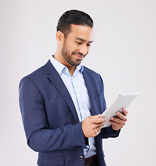 Image showing Business, happy asian man and tablet in studio for planning research, trading data or stock market information. Corporate trader scroll on digital technology for financial website on white background