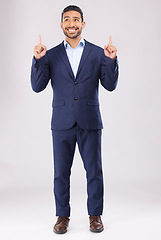 Image showing Happy, pointing and presentation with business man in studio for idea, advertising and news. Solution, space and announcement with person on white background for promotion, mockup and information