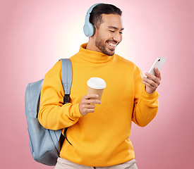 Image showing Backpack, phone and man listening to headphones or college podcast, travel and coffee on pink background. E learning mobile and person with bag, music or audio streaming and university chat in studio