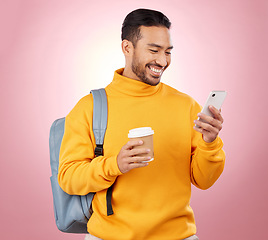 Image showing Backpack, phone and student or man on studio pink background for scholarship, university or college results. Learning, education and happy person in bag, coffee break and study information on mobile