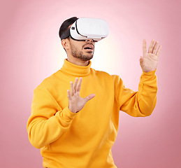 Image showing VR, glasses and man vision on studio pink background for software, digital world or user experience. Person with high tech gaming, wow and surprise for virtual reality, future technology or metaverse