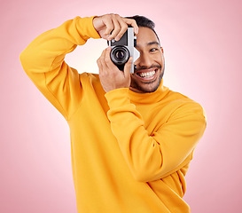 Image showing Portrait, man with a camera and smile for photography, taking a picture for art, travel or record of a happy memory. Creative photographer, happiness and shooting on retro or vintage film technology