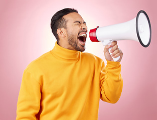 Image showing Asian man, megaphone and screaming for discount, sale or alert against a pink studio background. Male person shouting for advertising, marketing or announcement in notification, voice or protest
