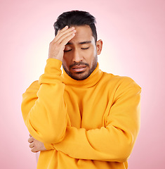 Image showing Stress, headache and asian man in studio with depression, broken heart or brain fog on pink background. Anxiety, migraine and Japanese guy in crisis, mistake or fail, vertigo or frustrated by trauma