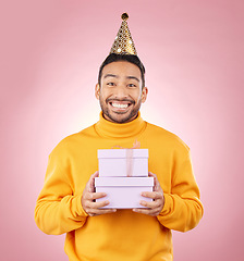 Image showing Man, portrait and present for birthday party, prize and giveaway celebration or success on pink background. Excited asian person or winner with gift boxes for retail competition or sale in studio