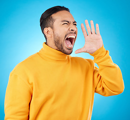 Image showing Announcement, hand and young man isolated on blue background for scholarship, sale or university broadcast. Shout, voice and opinion of person or student with college news or attention in studio