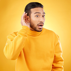 Image showing Asian man, listening and gossip with hand on ear in studio background for information. Shock, hearing and male person with surprised face about secret with attention or curiosity in mock up for news.