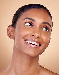 Image showing Face, beauty and happy woman, natural and cosmetics with skincare isolated on blue background. Indian female model, healthy glow and clean skin, dermatology and wellness with spa facial in a studio