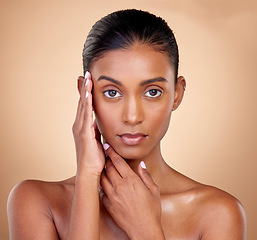 Image showing Portrait, makeup and Indian woman with cosmetics, dermatology and wellness against a brown studio background. Face, female person and model with health, luxury and aesthetic with self care and beauty