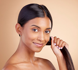 Image showing Strong hair, portrait or happy woman with beauty, skincare or self care for glow, shine or collagen in shampoo. Healthy texture, model or Indian girl smiling with cosmetics for treatment or grooming