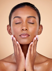 Image showing Relax, skincare or natural woman with wellness, beauty or facial glow with dermatology cosmetics in studio. Hands, background or face of Indian girl model resting with shine, eyes closed or self love