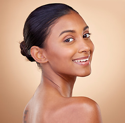 Image showing Portrait, beauty or happy woman with natural facial glow with dermatology skincare cosmetics in studio. Face, brown background or aesthetic Indian girl model smiling with , wellness or self love