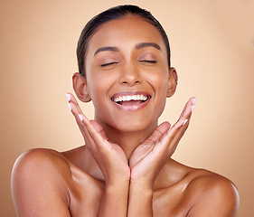 Image showing Relax, skincare or happy woman with natural beauty or facial glow with dermatology cosmetics in studio. Eyes closed, wellness or face of Indian girl model laughing with makeup, smile or self love