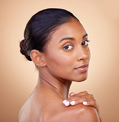 Image showing Portrait, beauty or Indian woman with natural facial glow with dermatology skincare cosmetics in studio. Aesthetic face, brown background or girl model with wellness, makeup shine or self love