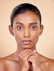 Image showing Portrait, skincare and woman with self care, cosmetics and luxury on a brown studio background. Face, female person or model with makeup, shine and glow with natural beauty, dermatology and aesthetic