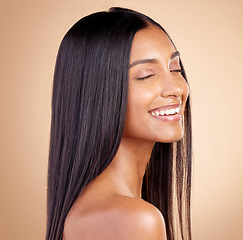 Image showing Happy, hair and woman, beauty and shine with cosmetic care isolated on brown studio background. Female model smile, haircare and growth, cosmetology and texture with growth and salon hairstyle glow