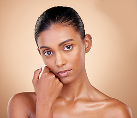 Image showing Skincare, beauty and portrait with indian girl with glow in brown studio background. Natural, serious face and dermatology with cosmetics for luxury facial for spa treatment with self care in mock up