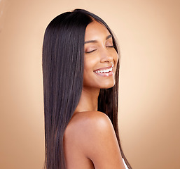 Image showing Beauty, happy and hair with face of woman in studio for shampoo, salon and hairstyle. Skincare, cosmetics and self care with female model on brown background for makeup, glow and spa treatment