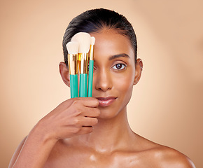 Image showing Beauty, makeup and brush with portrait of woman in studio for facial, foundation and self care. Cosmetics, product and tools with face of model on brown background for glow, skincare and dermatology