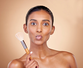 Image showing Kiss, makeup and brush with portrait of woman in studio for beauty, foundation and self care. Cosmetics, product and tools with face of model on brown background for glow, skincare and dermatology