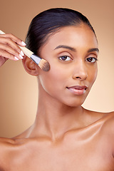 Image showing Foundation, makeup and brush with portrait of woman in studio for facial, beauty and self care. Cosmetics, product and tools with face of model on brown background for glow, skincare and dermatology