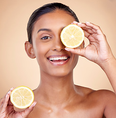 Image showing Lemon, portrait ad natural skincare of woman in studio for vitamin c benefits, eco cosmetics and nutrition. Face of indian female model, healthy beauty or citrus fruit for aesthetic vegan dermatology